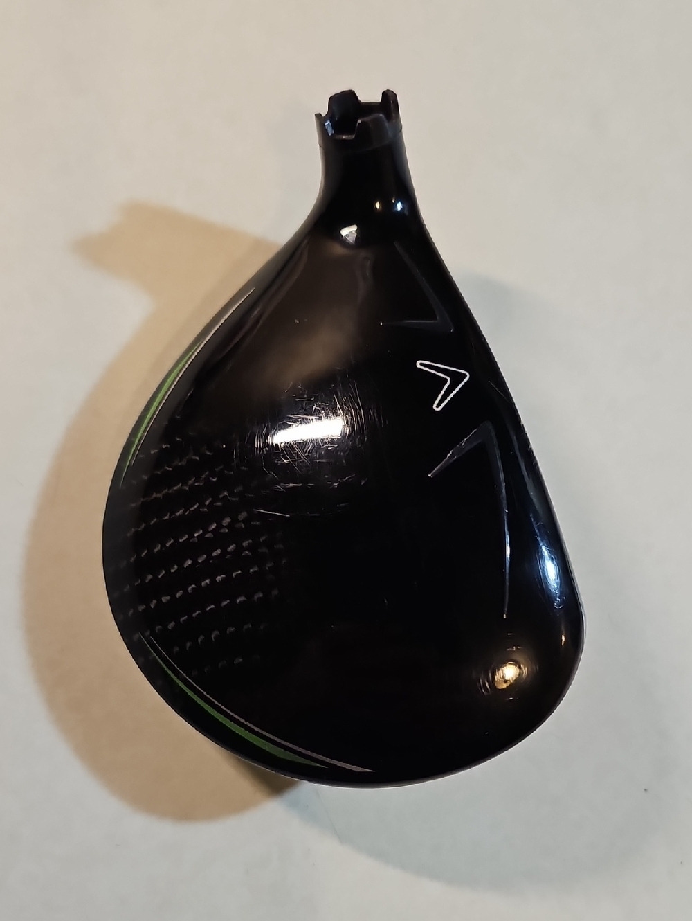Black Golf Driver Head with Green Accents